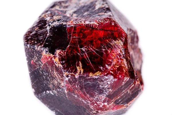 What are the red crystals? What is the meaning of Almandine and Zircon?